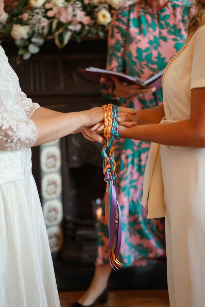 Binding of hands during ceremony with Tara the Celebrant