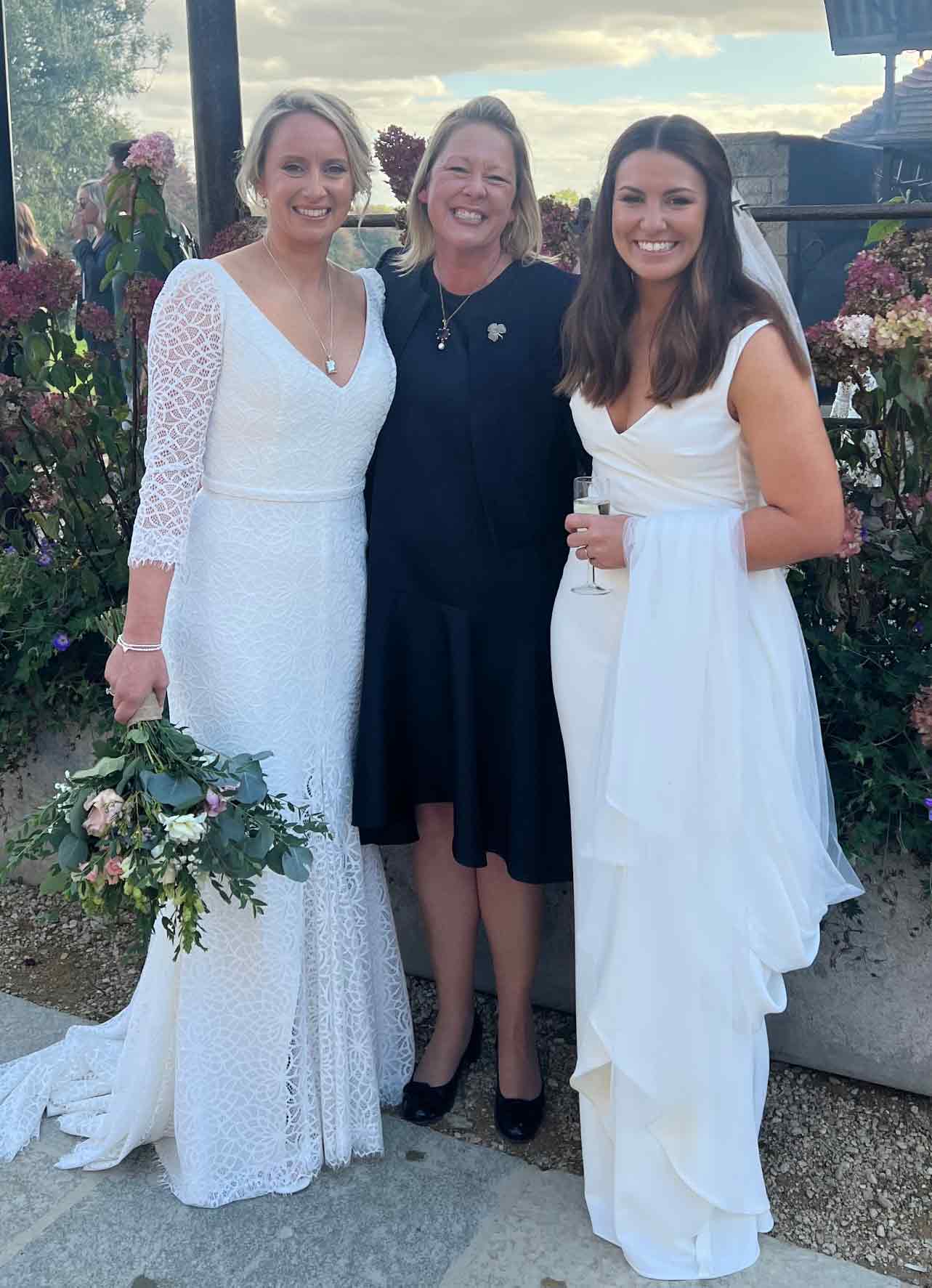 Two happy brides at their celebrant wedding with Tara