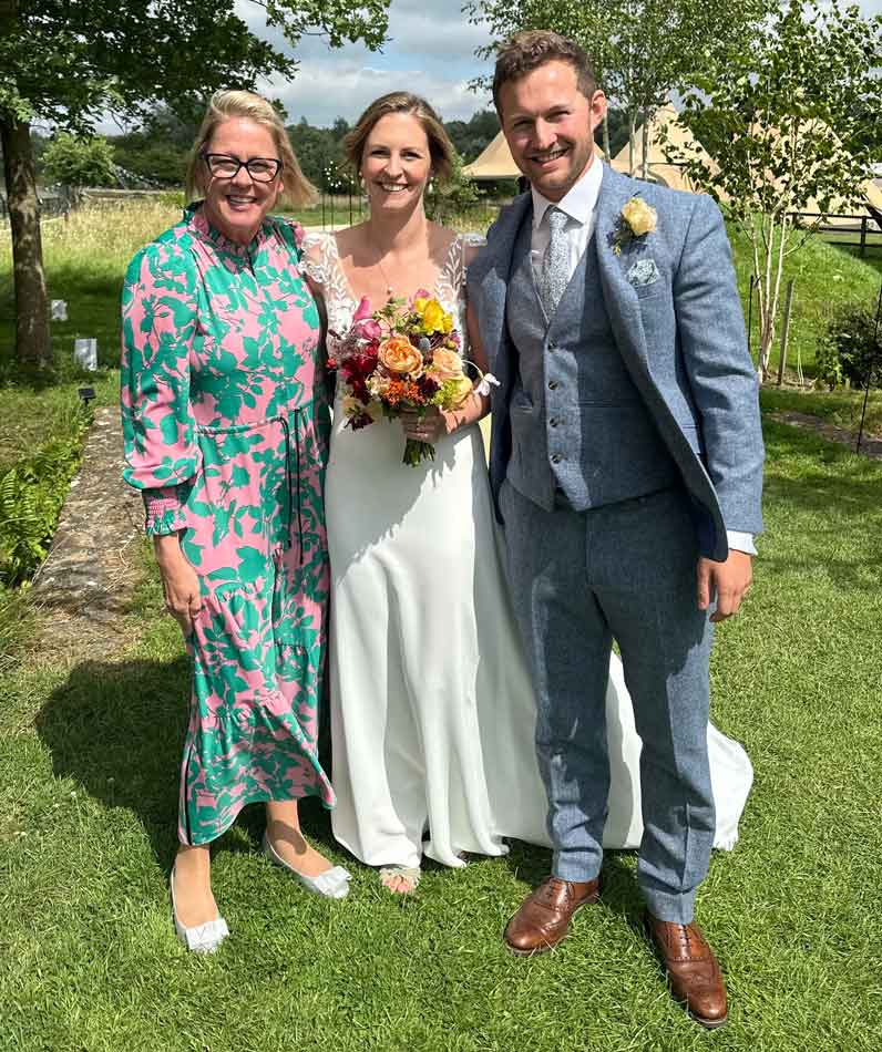 A bride and groom at their wedding with Tara the Celebrant in The Cotswolds
