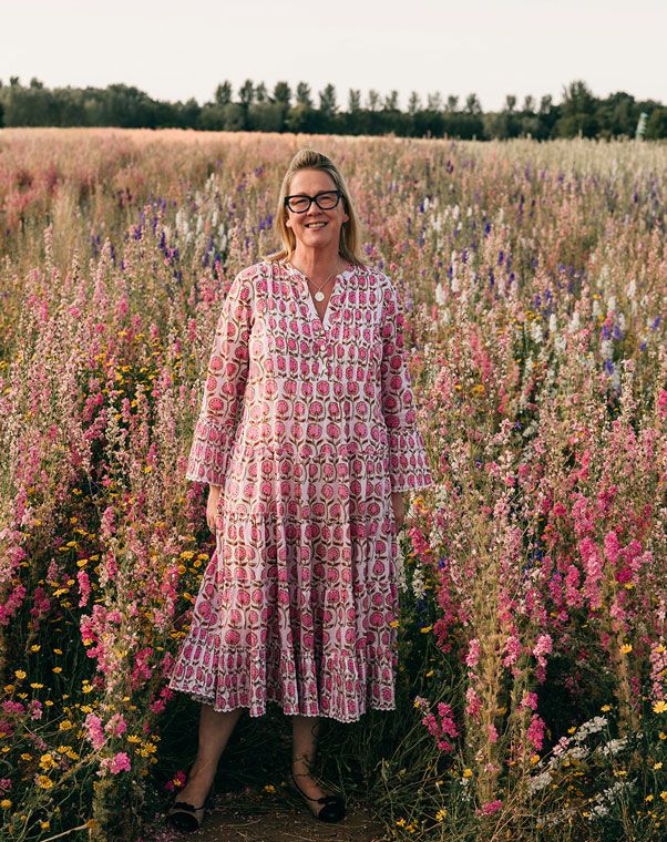 wedding-celebrant-cotswolds Tara the Celebrant standing in a wildflower meadow