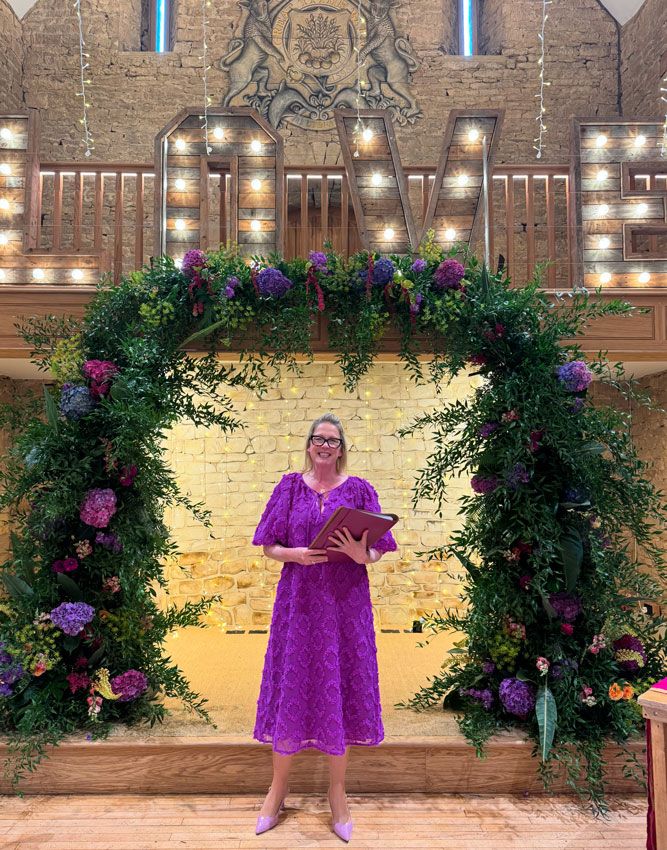 celebrant-weddings-bristol Tara the Celebrant standing under a big lit love sign