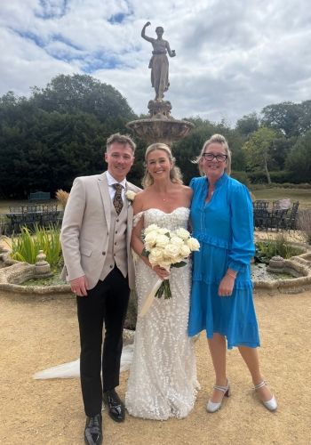A bride and groom with Tara the Celebrant at their Clevedon Hall wedding