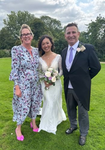 A happy wedding couple at Whatley Manor Hotel with Tara the Celebrant